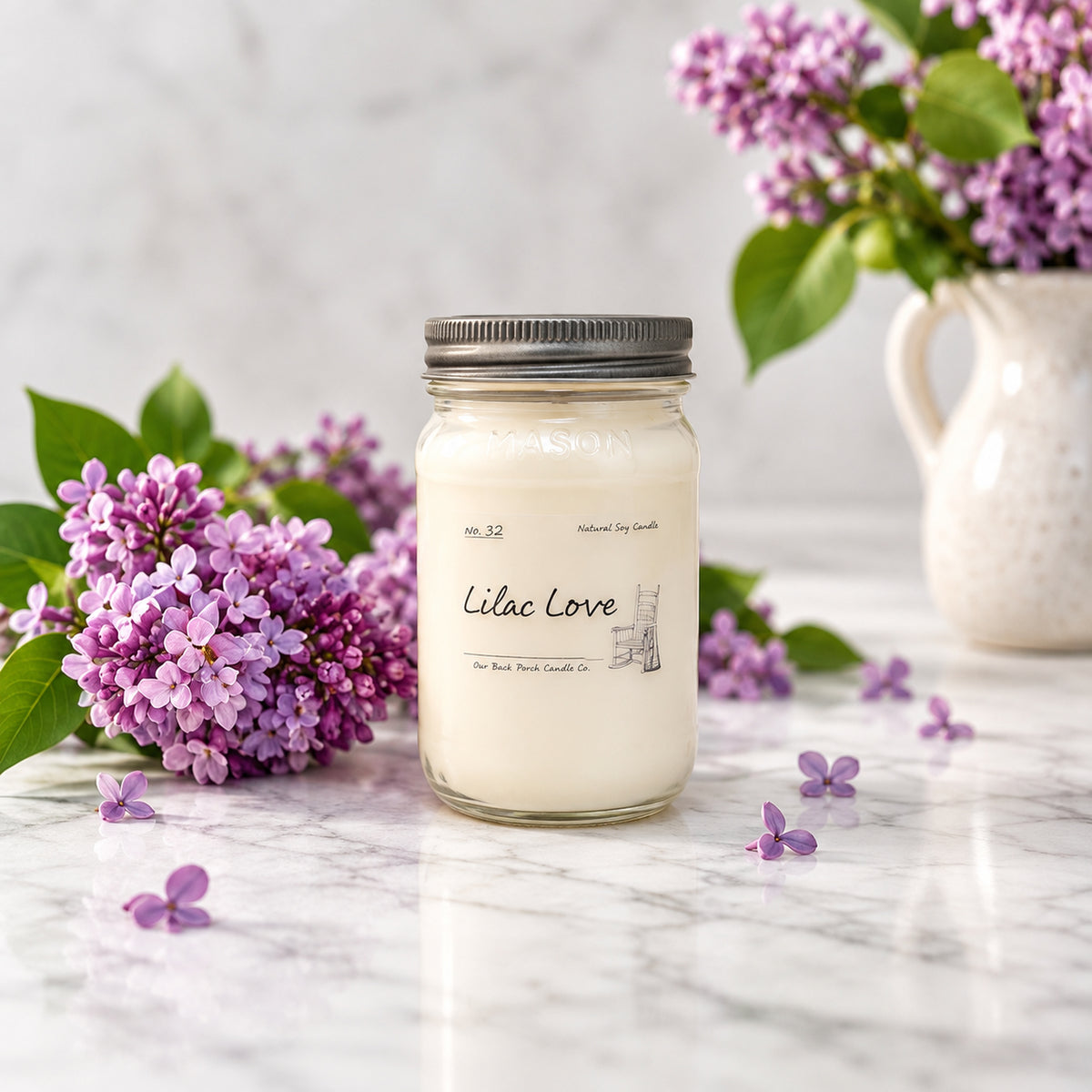 Lilac Love 16 oz soy candle by Back Porch Candle Co. styled with fresh lilacs in a soft spring setting.