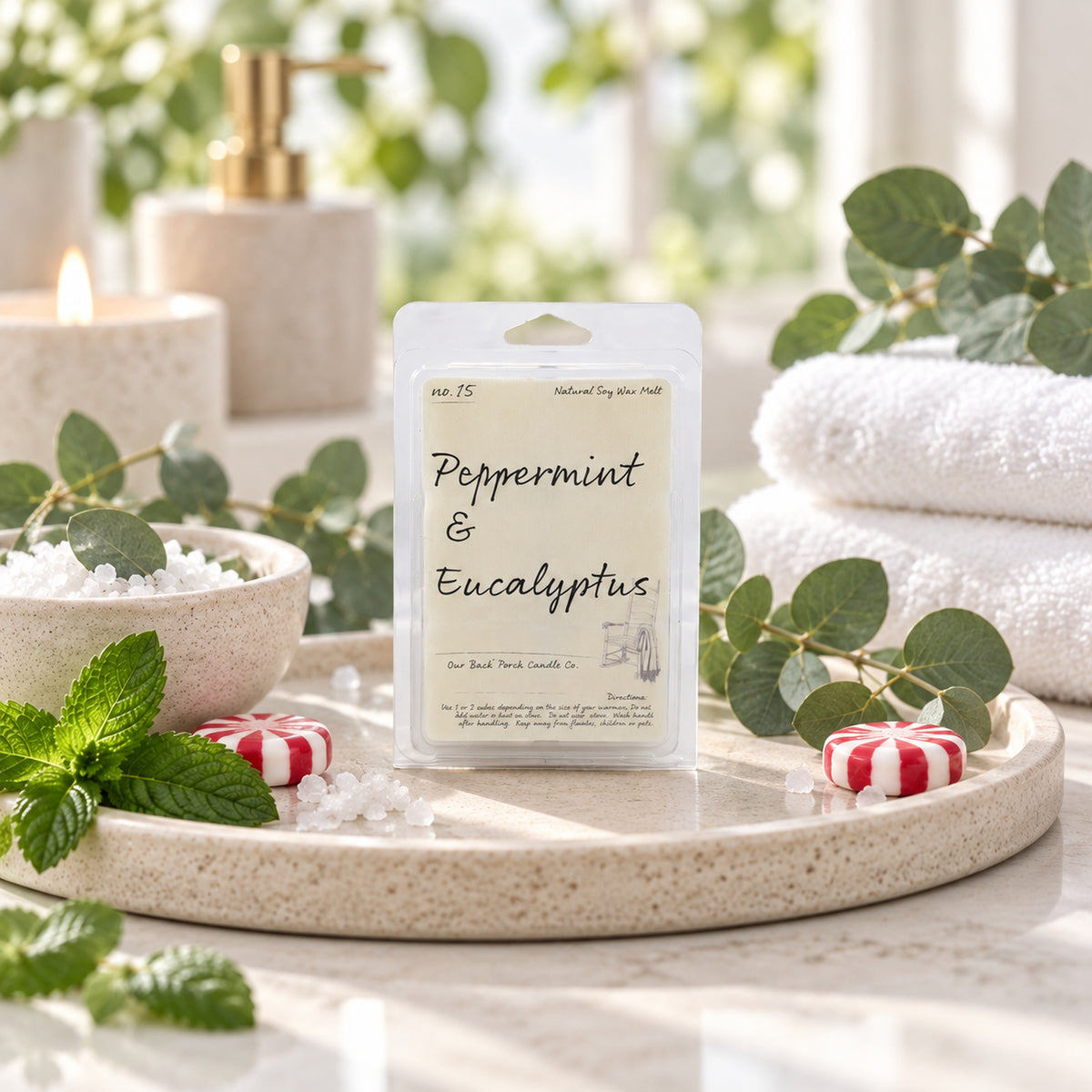 Peppermint & Eucalyptus soy wax melt by Back Porch Candle Co. styled in a fresh spa-inspired setting with mint and eucalyptus.