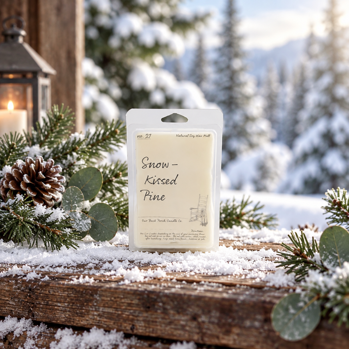 Back Porch Candle Co Snow-Kissed Pine 6 oz soy wax melt with snow-covered evergreens, pinecones, and a winter mountain setting.