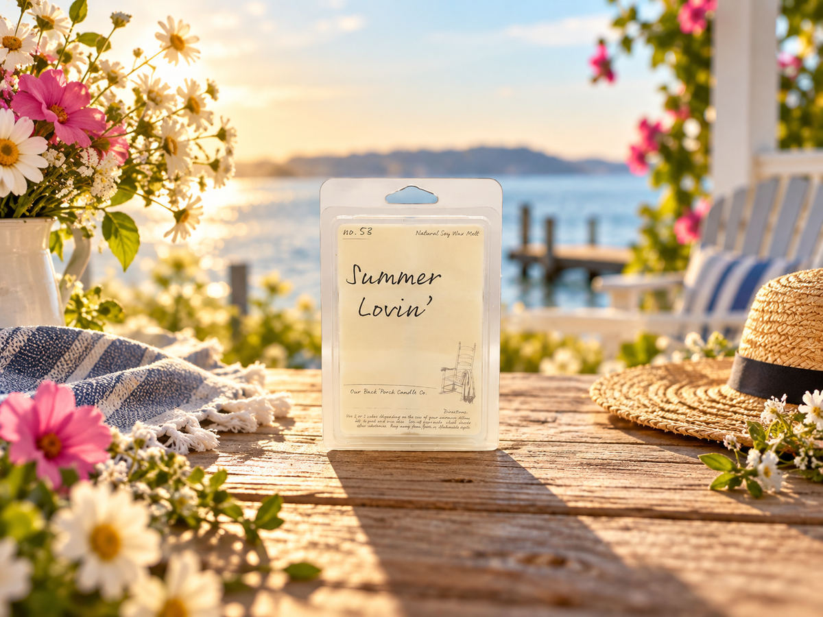 Back Porch Candle Co Summer Lovin' 6 oz soy wax melt in a bright lakeside summer setting with wildflowers and warm golden light.