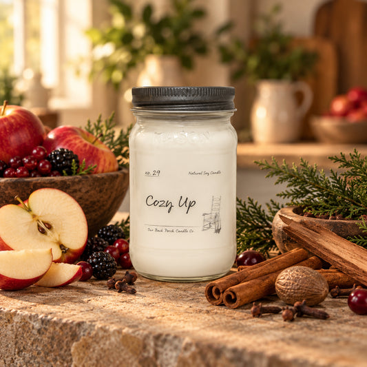 Cozy Up 16 oz soy candle by Back Porch Candle Co. styled with apples, berries, warm spices, sandalwood and cypress.
