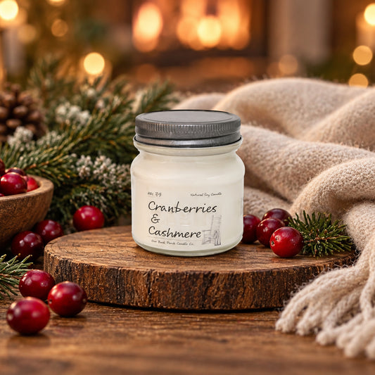 Cranberries & Cashmere 8 oz soy candle by Back Porch Candle Co. in a warm cranberry and cashmere-inspired setting.