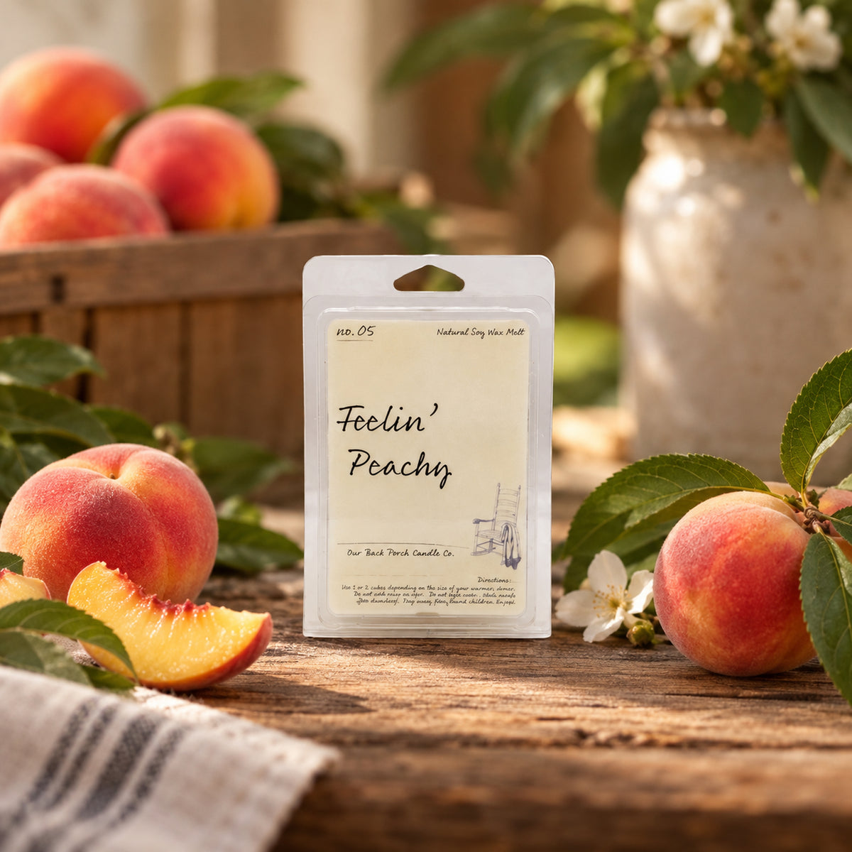 Feelin' Peachy soy wax melt by Back Porch Candle Co. styled with juicy peaches and warm golden light.