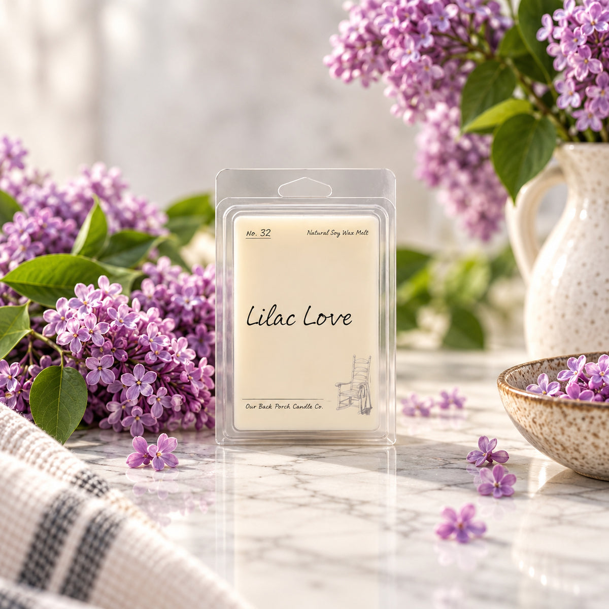Lilac Love soy wax melt by Back Porch Candle Co. styled with fresh lilacs and soft spring light.