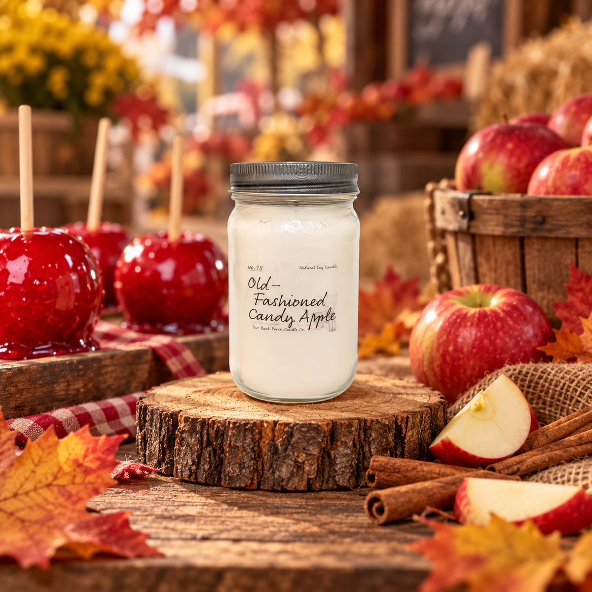 Old-Fashioned Candy Apple 16 oz soy candle by Back Porch Candle Co. styled with candy apples, crisp apples, cinnamon, and warm autumn details.